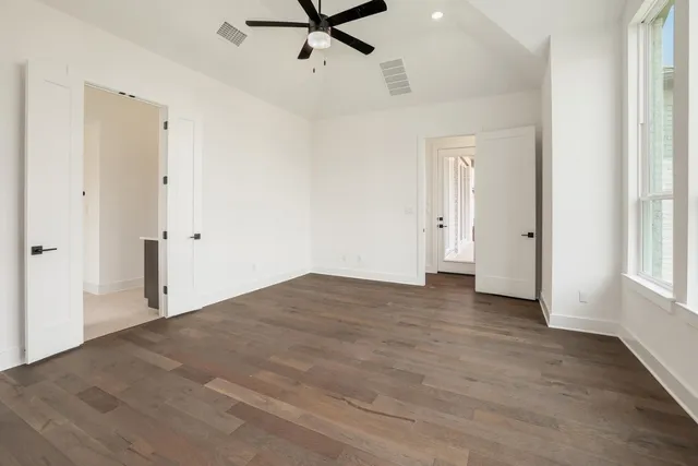 a large kitchen with stainless steel appliances kitchen island a large counter top and a sink