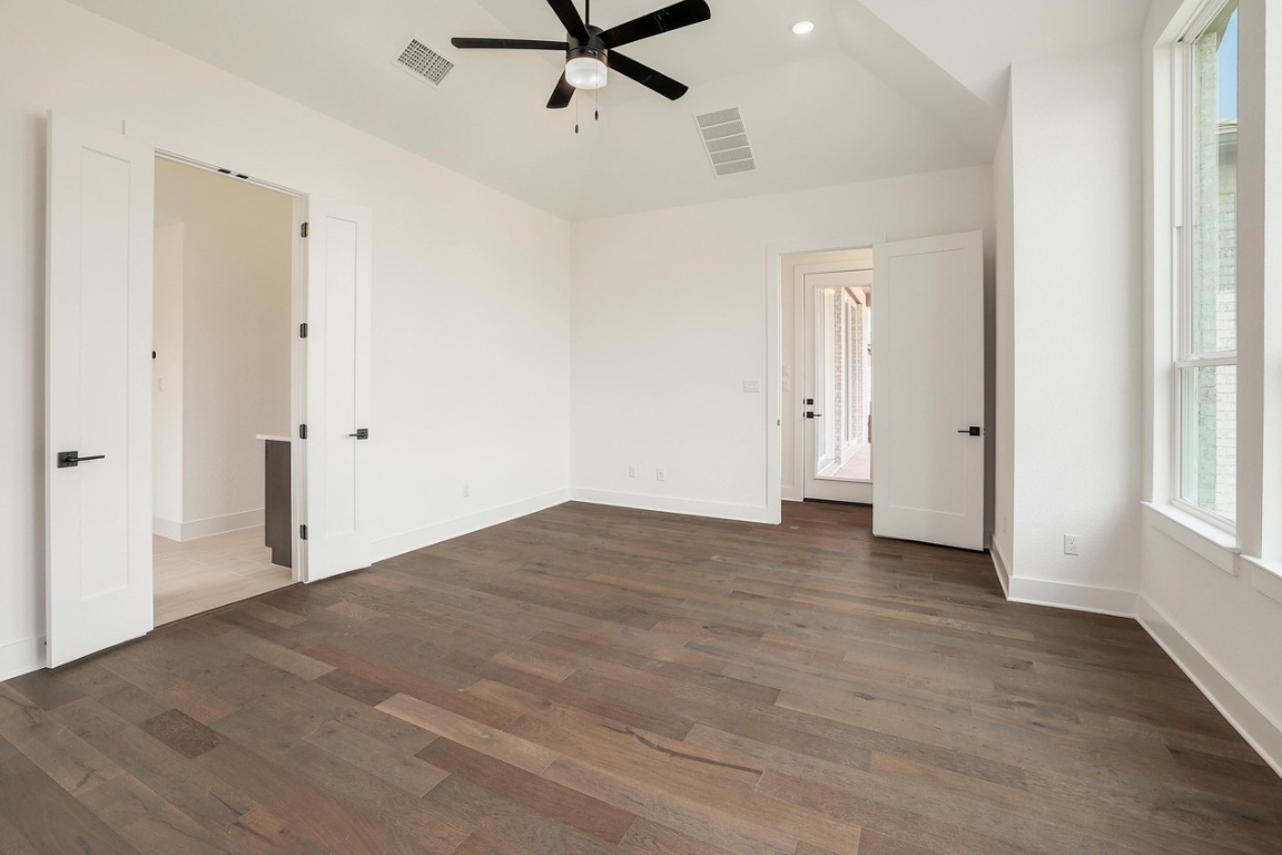 1604 Lilly Grace Bend Leander, TX 78641 - Photo 9 of 22 a view of a livingroom with a ceiling fan & entryway
