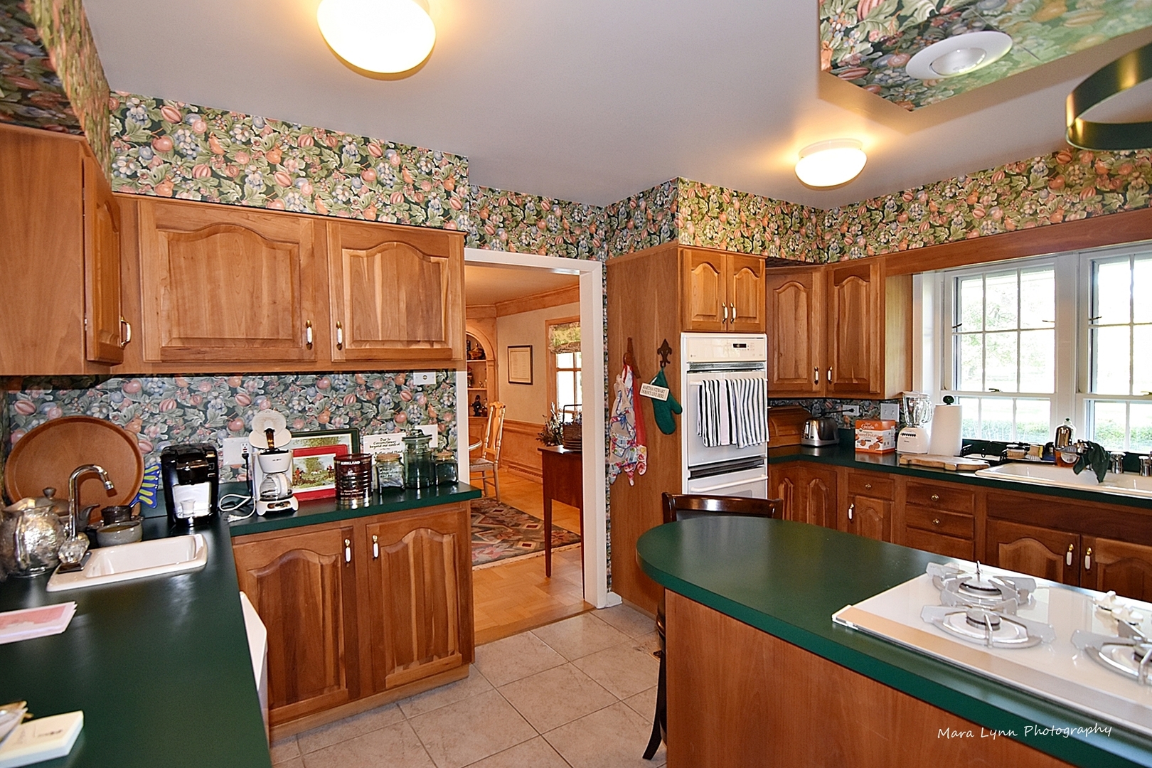 6-n063 Surrey Road Wayne, IL 60184 - Photo 14 of 40 a kitchen with stainless steel appliances granite countertop a sink and cabinets