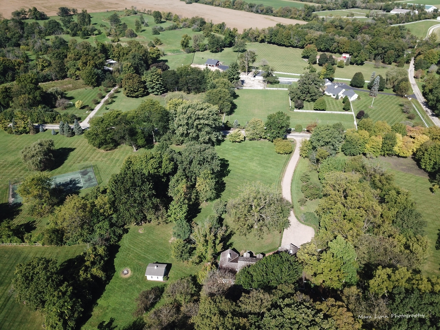 6-n063 Surrey Road Wayne, IL 60184 - Photo 4 of 40 an aerial view of residential houses with outdoor space and trees