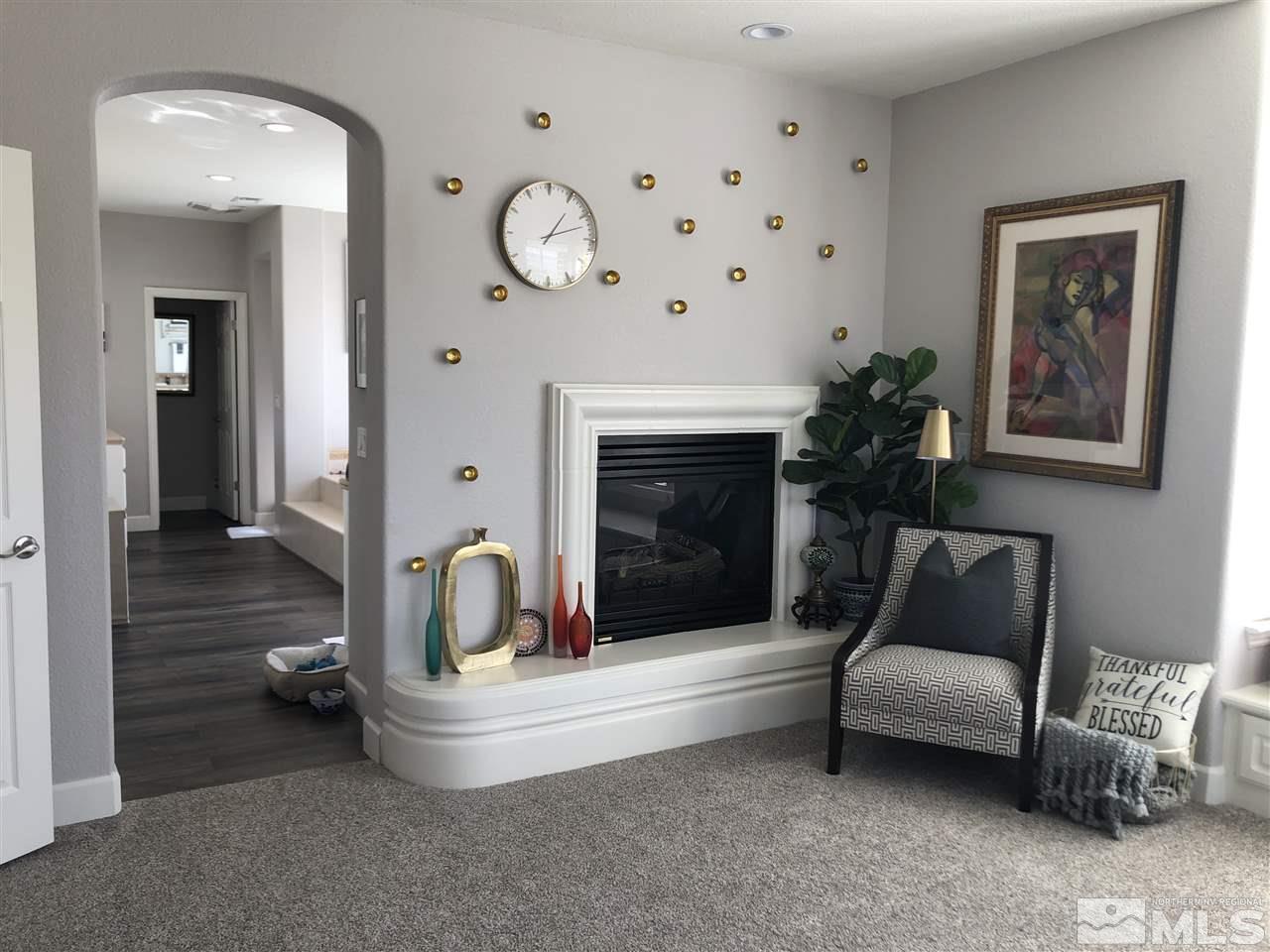 2963 Stonebridge Trail Reno, NV 89511 - Photo 17 of 21 a living room with furniture and a fireplace