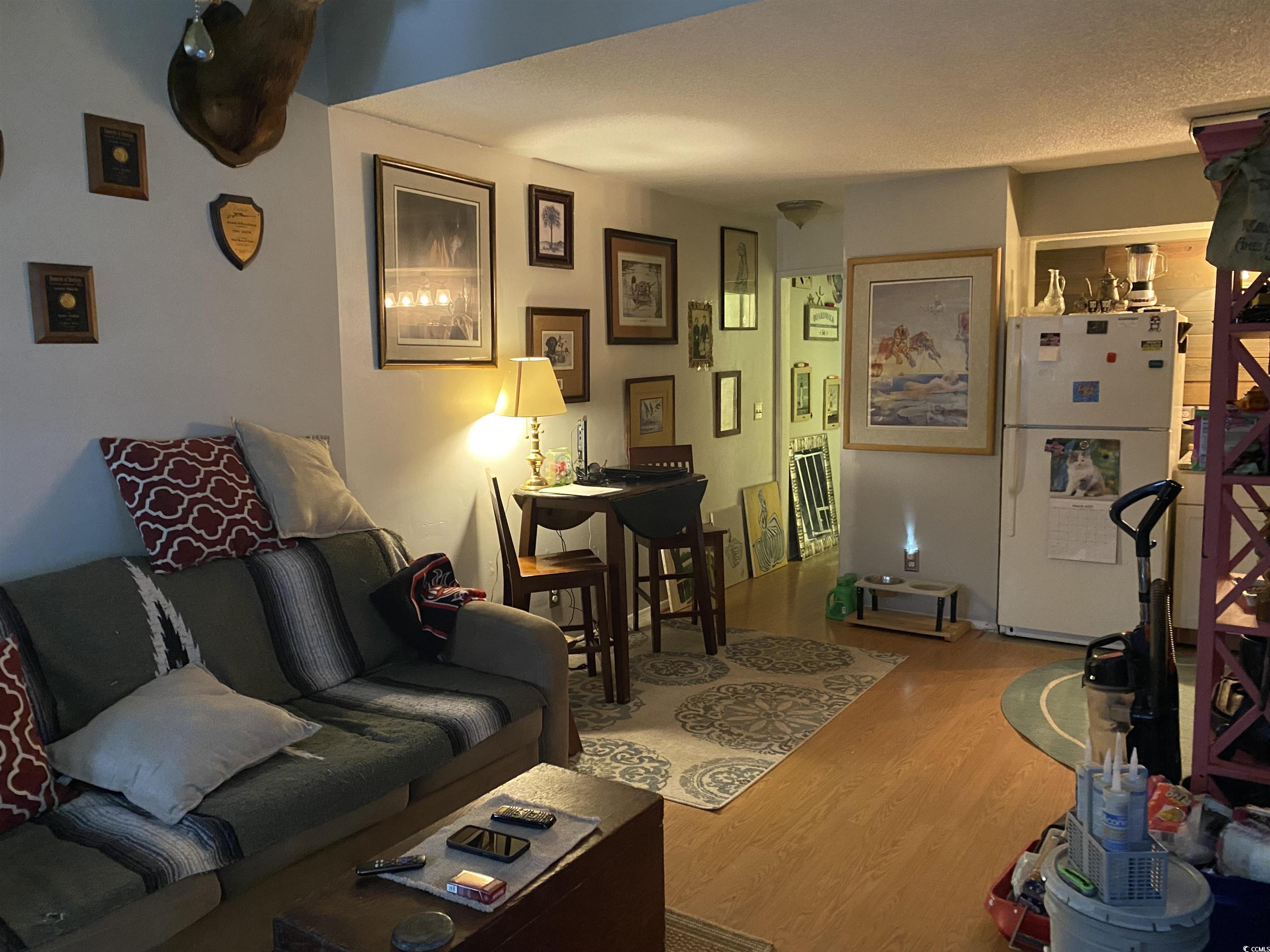 405 Cambridge Circle, Unit B5 Murrells Inlet, SC 29576 - Photo 7 of 14 Living area with wood finished floors