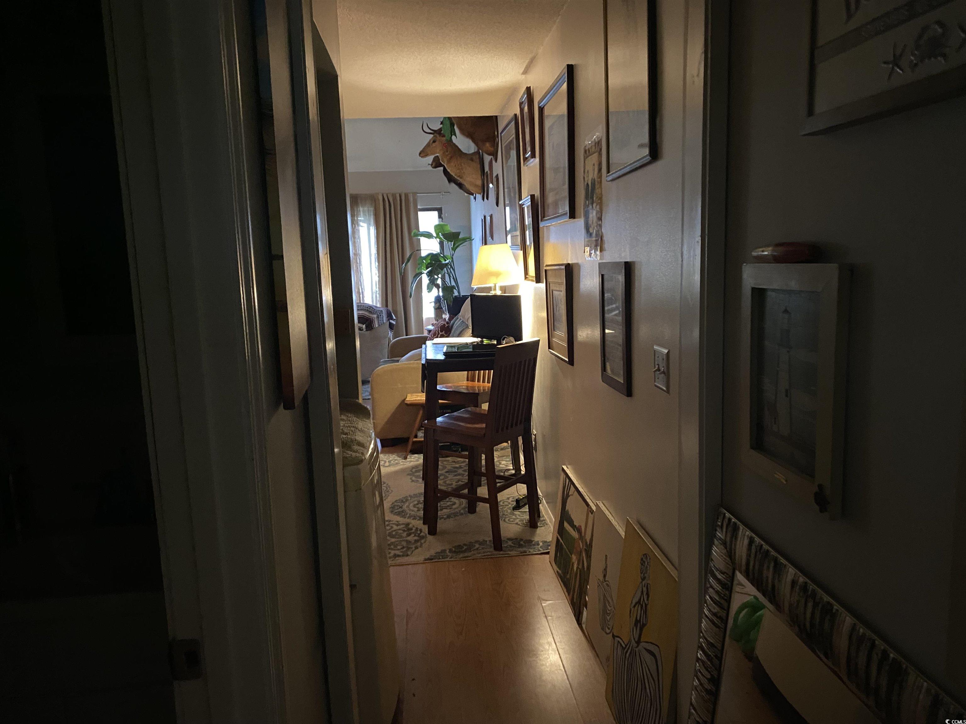 405 Cambridge Circle, Unit B5 Murrells Inlet, SC 29576 - Photo 8 of 14 Corridor featuring wood finished floors