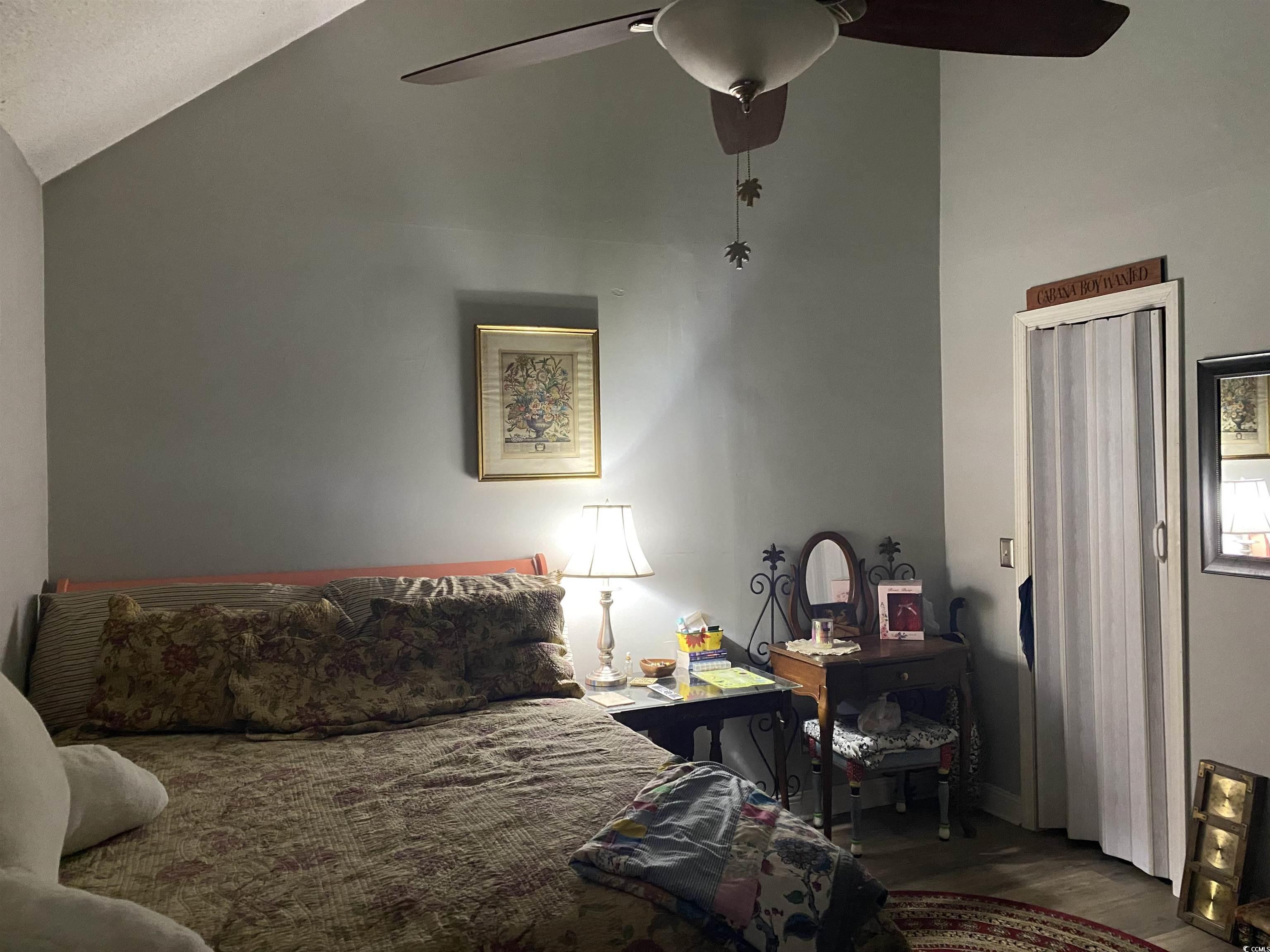 405 Cambridge Circle, Unit B5 Murrells Inlet, SC 29576 - Photo 9 of 14 Bedroom with a ceiling fan, lofted ceiling, and wo