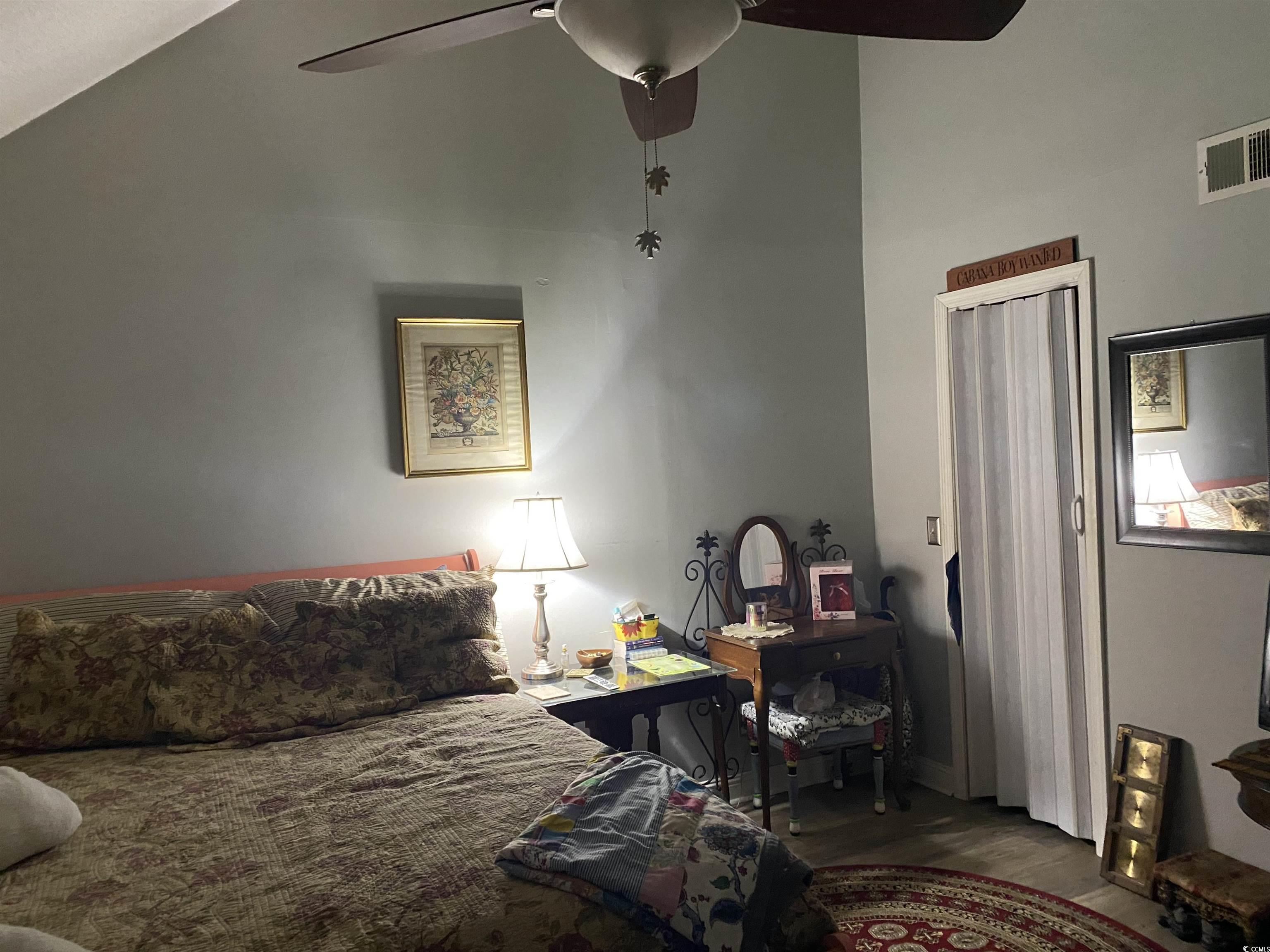 405 Cambridge Circle, Unit B5 Murrells Inlet, SC 29576 - Photo 10 of 14 Bedroom featuring a ceiling fan, wood finished flo