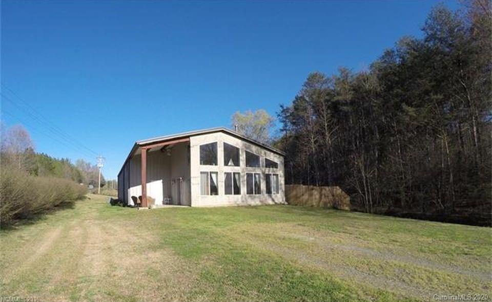 21 Lake Adger Road Mill Spring, NC 28756 - Photo 1 of 17 a front view of a house with a yard