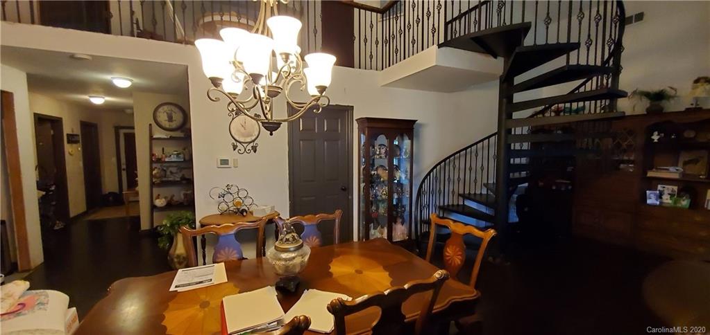 21 Lake Adger Road Mill Spring, NC 28756 - Photo 11 of 17 a view of a dining room with furniture