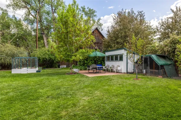 a house view with a sitting space garden view