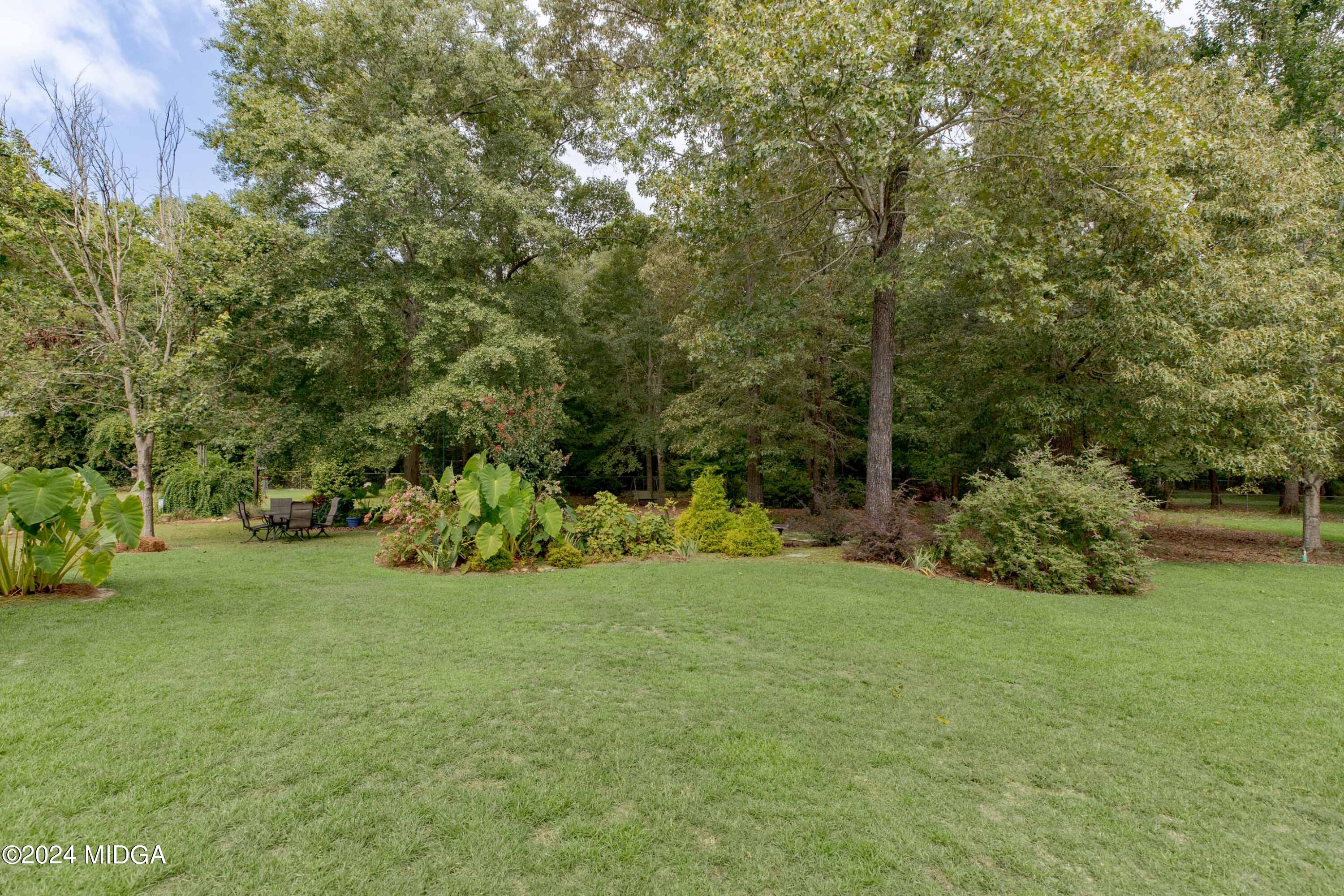 2624 Burnett Road Byron, GA 31008 - Photo 54 of 71 a view of a field with trees in the background