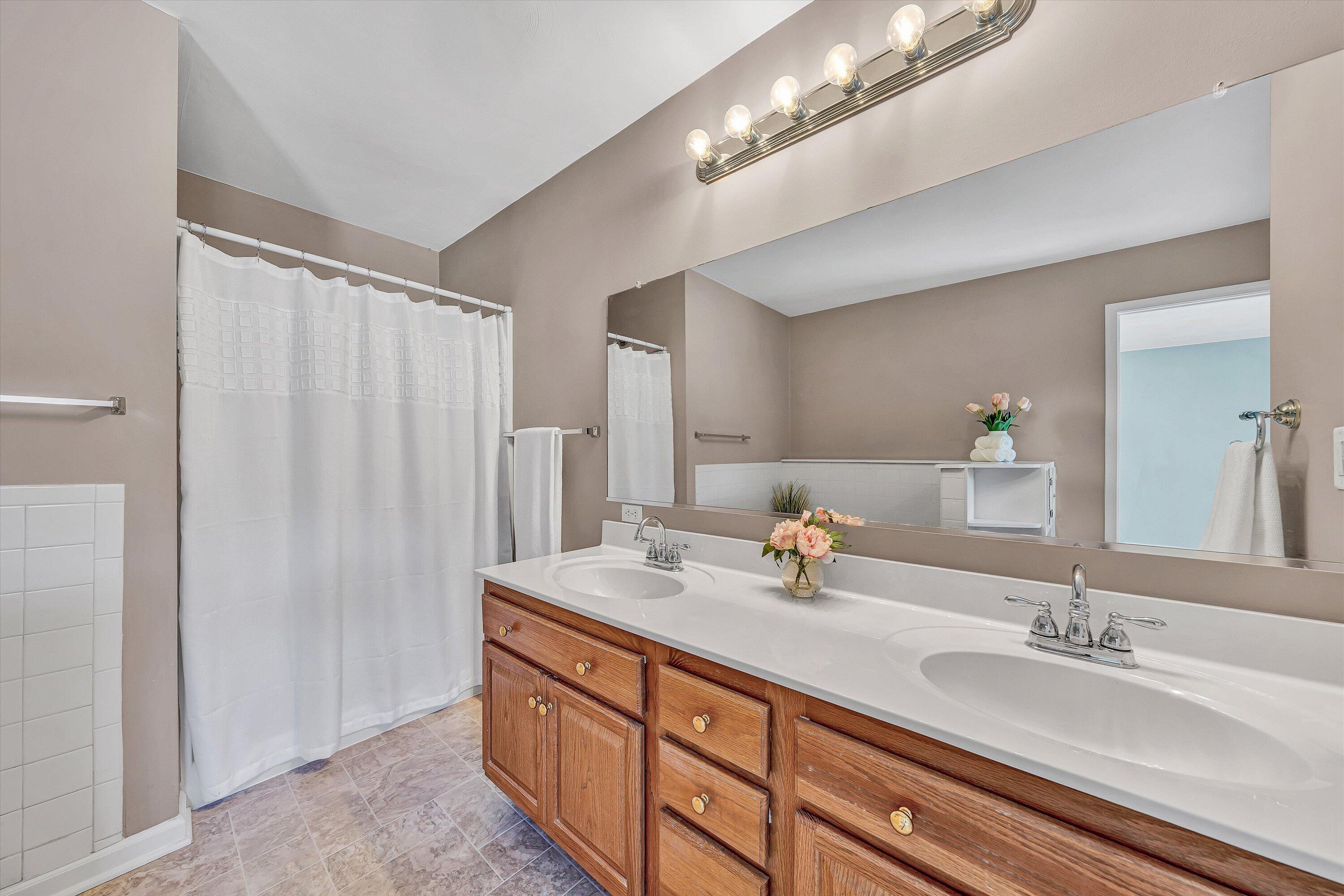3516 Pinnacle Ridge Road Northeast Roanoke, VA 24012 - Photo 22 of 39 a bathroom with double vanity and a mirror