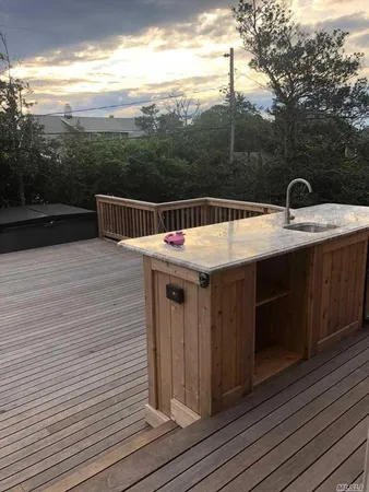a view of a balcony with furniture