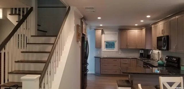 a kitchen with sink cabinets and microwave