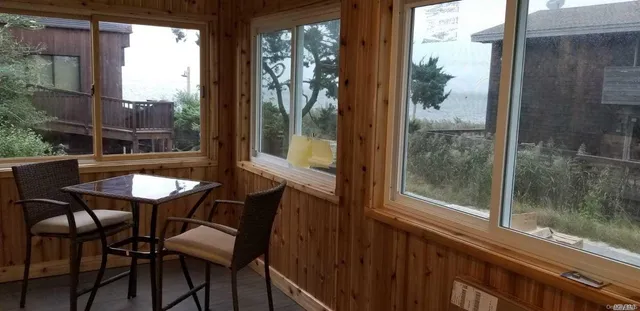 a view of a balcony dining table and chairs