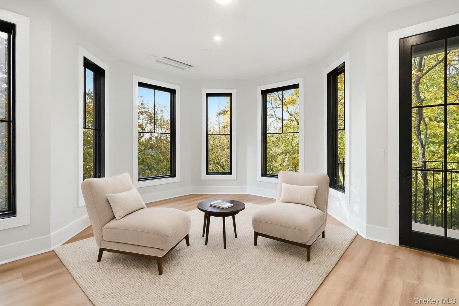 34 Clinton Avenue, Unit 4 Dobbs Ferry, NY 10522 - Photo 12 of 15 a living room with furniture and a large window