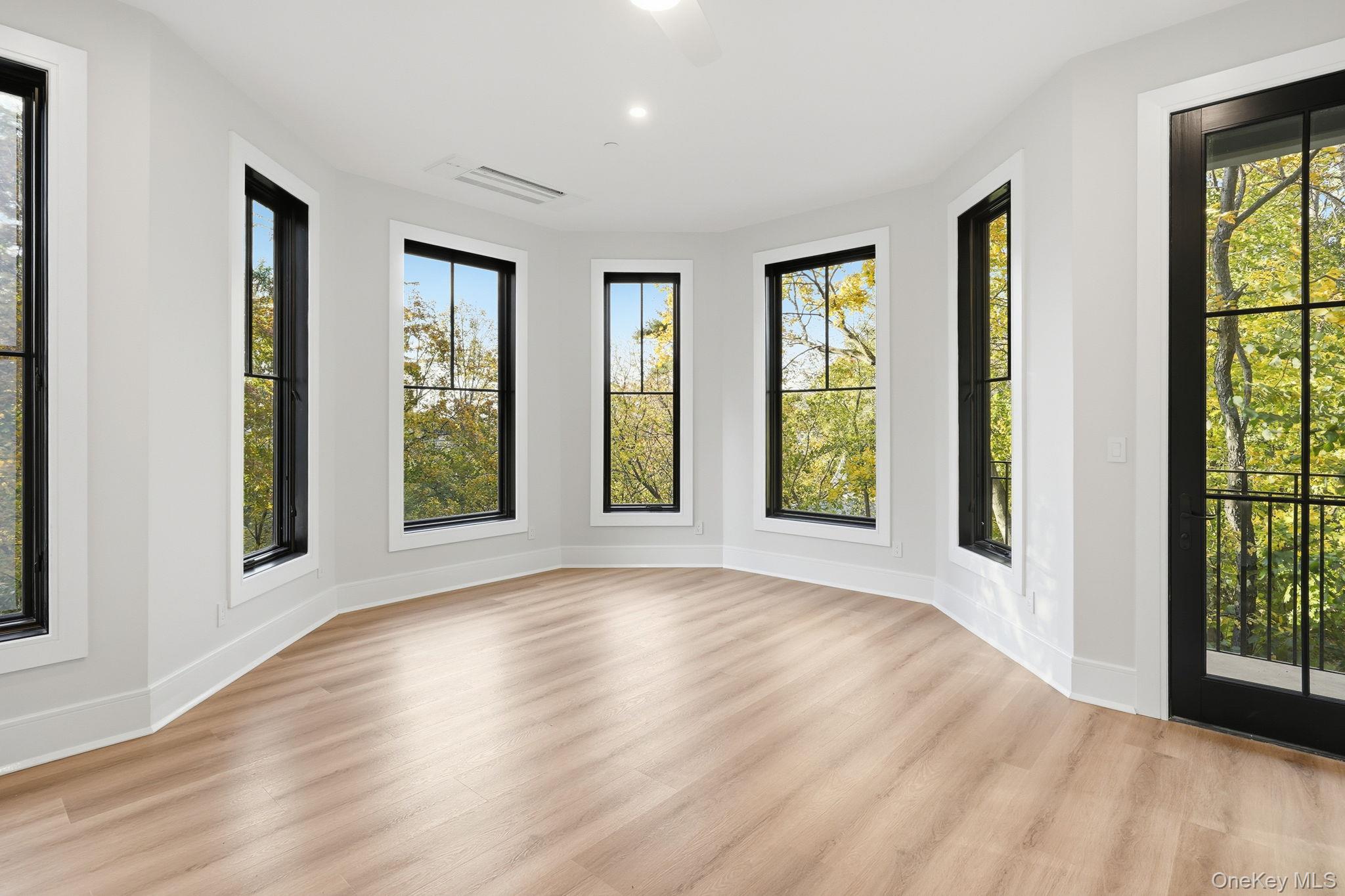 34 Clinton Avenue, Unit 4 Dobbs Ferry, NY 10522 - Photo 13 of 15 a view of an empty room with glass door and balcony