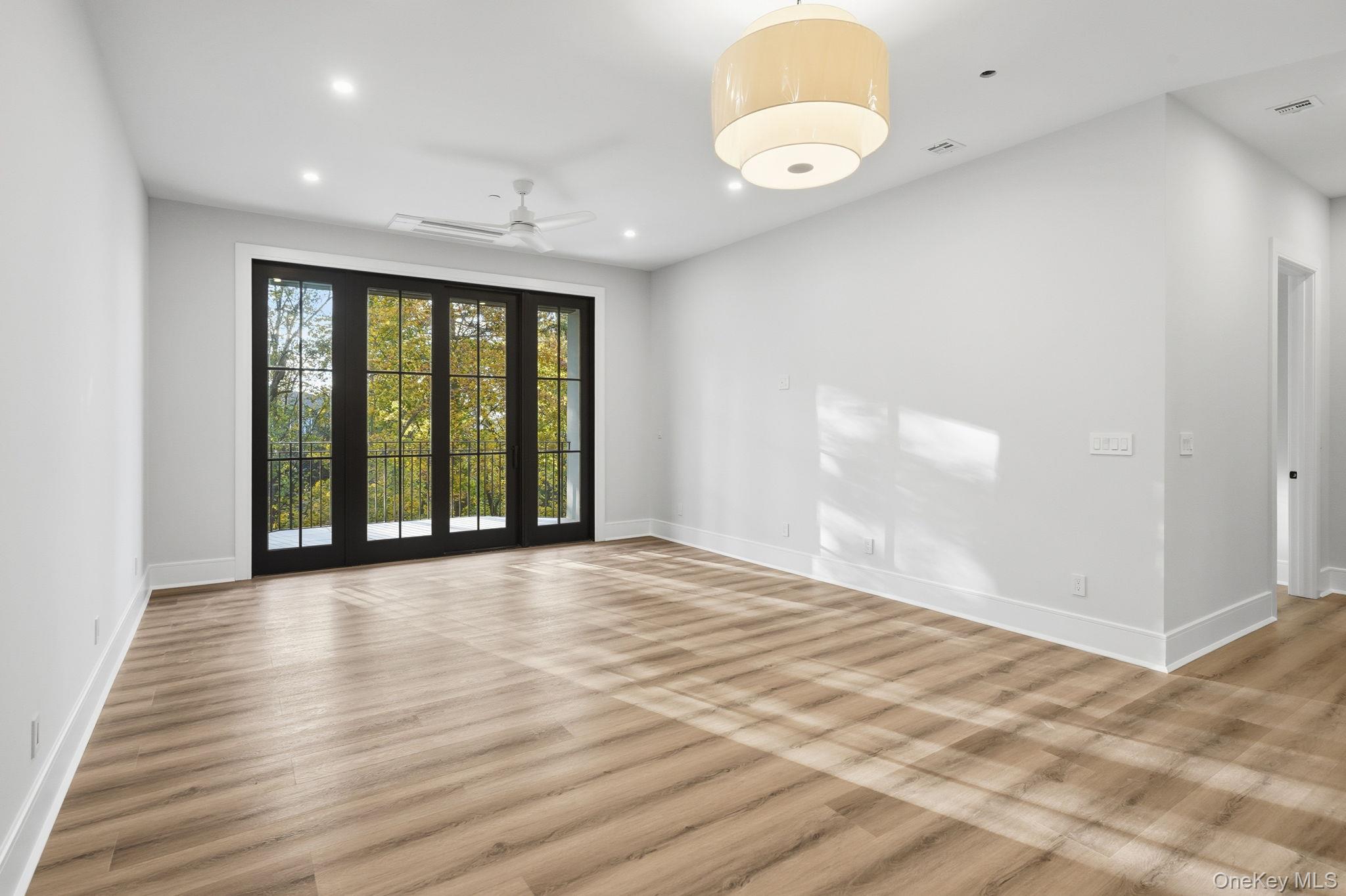 34 Clinton Avenue, Unit 4 Dobbs Ferry, NY 10522 - Photo 6 of 15 a view of an empty room with wooden floor and a window