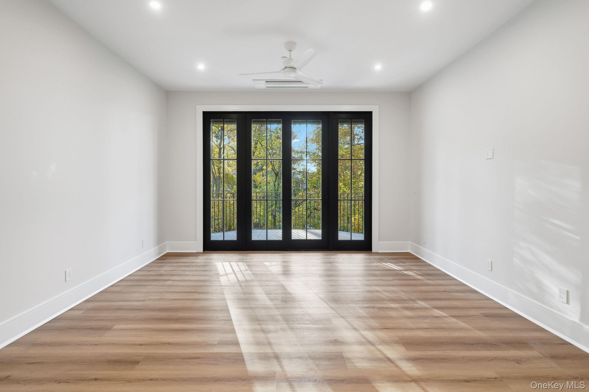 34 Clinton Avenue, Unit 4 Dobbs Ferry, NY 10522 - Photo 7 of 15 a view of an empty room with wooden floor and a window