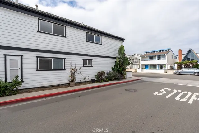 a view with granite countertop kitchen island with sink and natural light