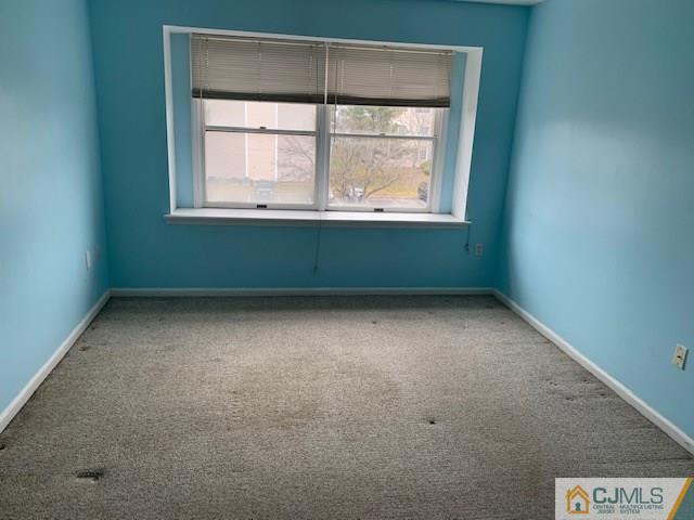 1230 Edpas Road, Unit 1230 New Brunswick, NJ 08901 - Photo 8 of 12 an empty room with a window