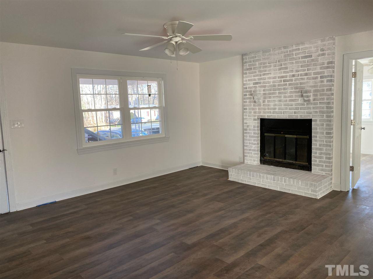 1314 Ed Cook Road Durham, NC 27703 - Photo 1 of 17 Whitewashed fireplace, mantel will be added soon