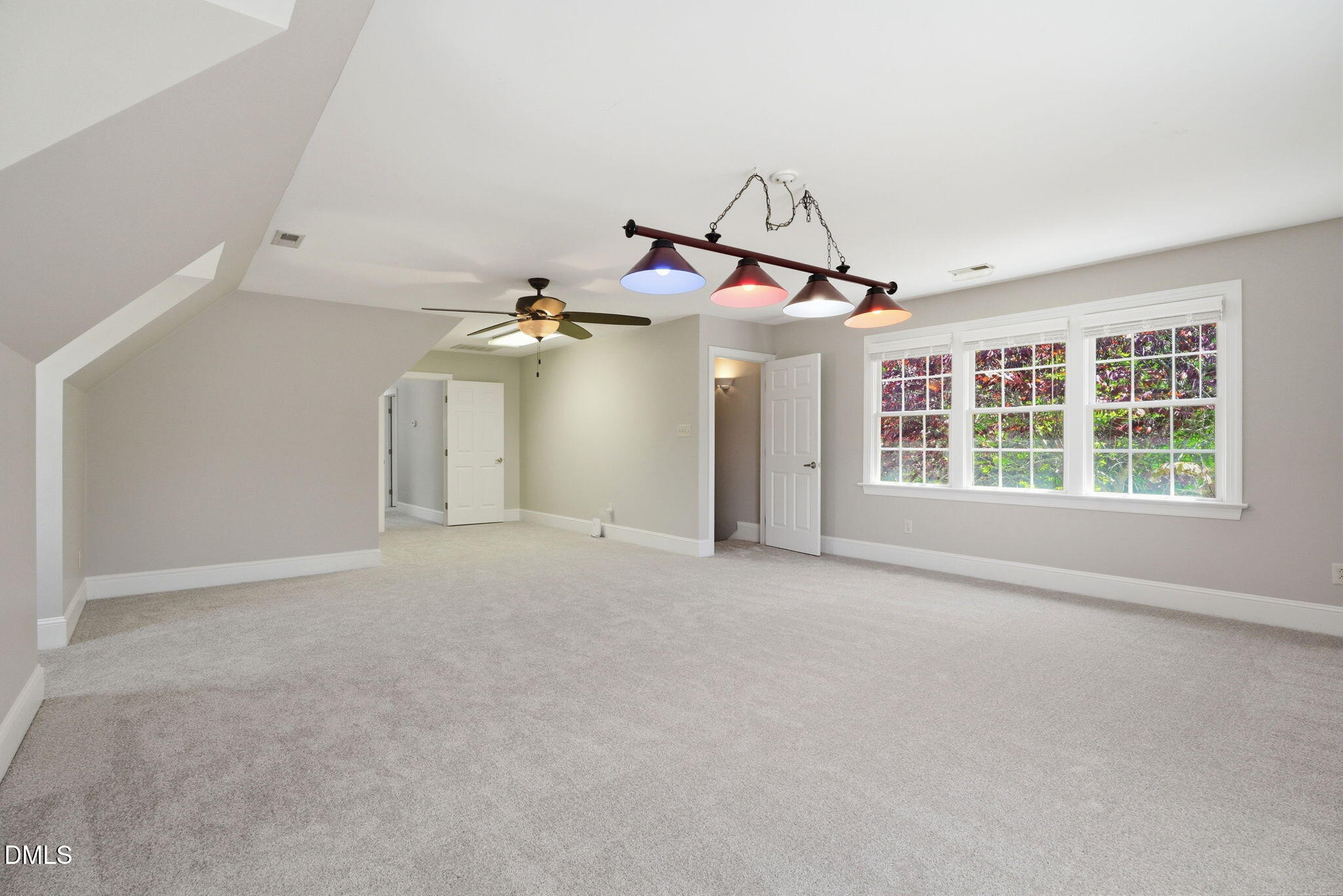 5416 Pulley Town Road Zebulon, NC 27597 - Photo 35 of 74 a view of a livingroom with a ceiling fan and window