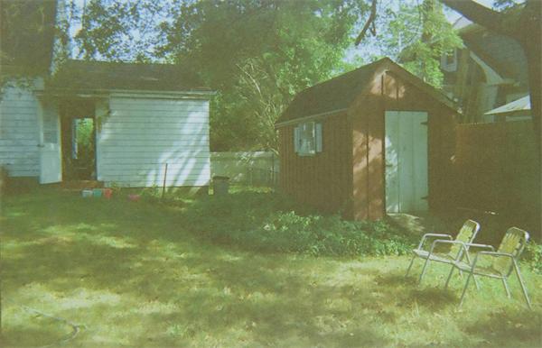 120 County Road Barrington, RI 02806 - Photo 7 of 8 a backyard of a house with table and chairs