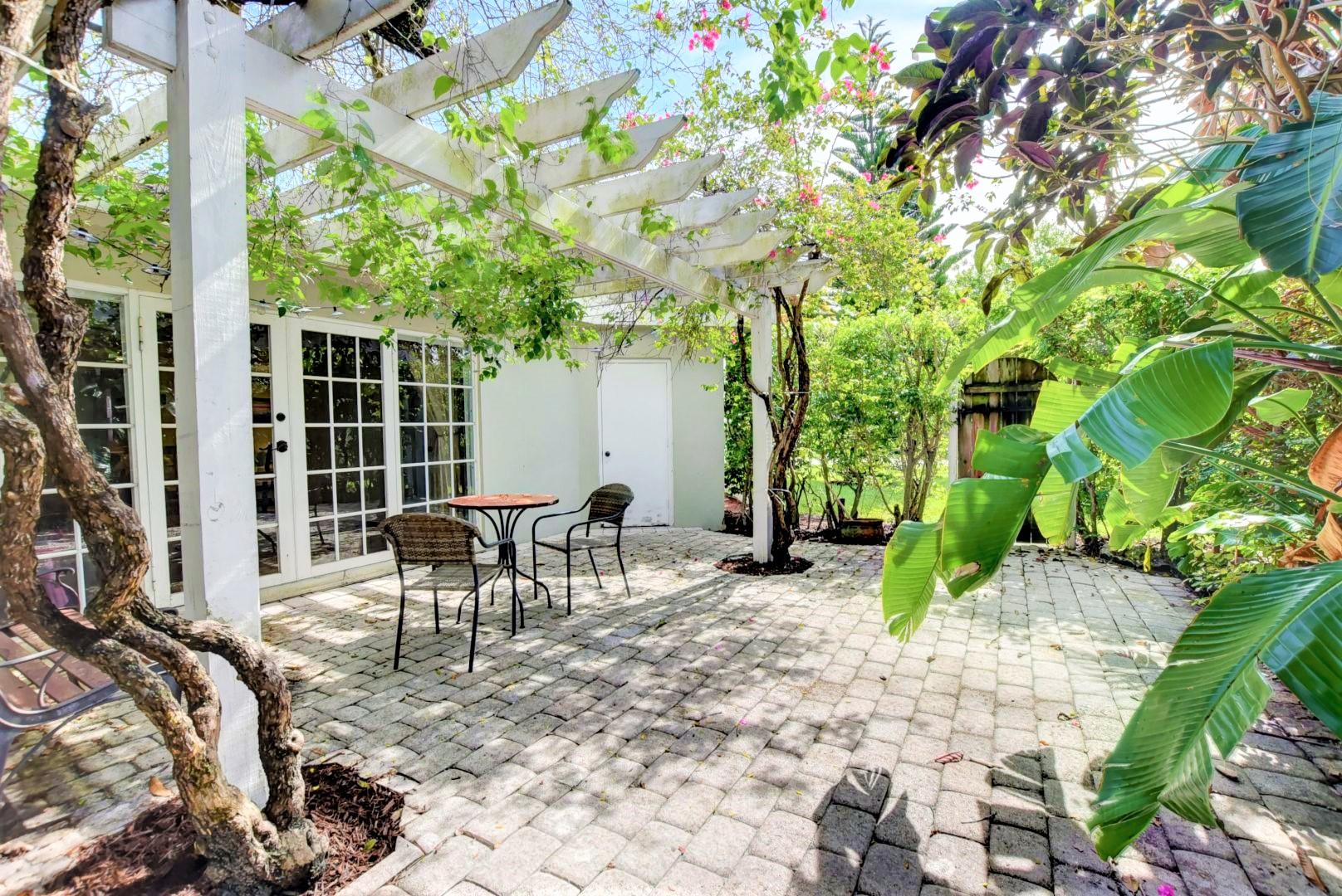 501 Southwest 8th Terrace Boca Raton, FL 33486 - Photo 2 of 28 Trellis paved patio french doors