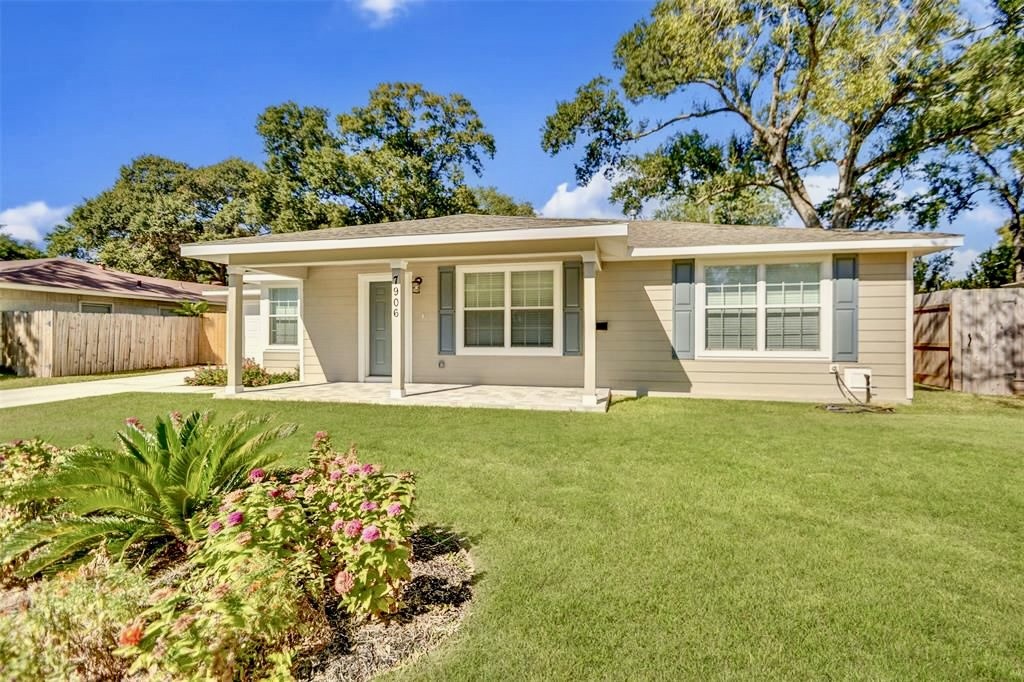 front view of a house with a garden