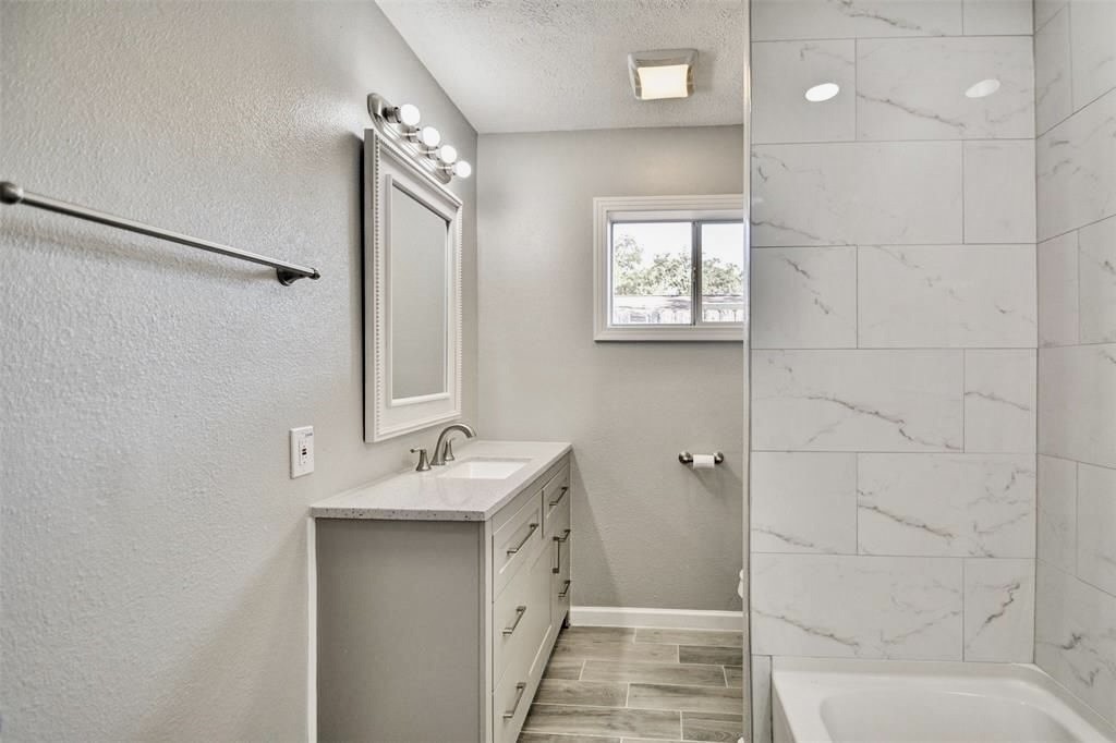 7906 Hammerly Boulevard Houston, TX 77055 - Photo 13 of 22 a bathroom with a sink toilet and shower