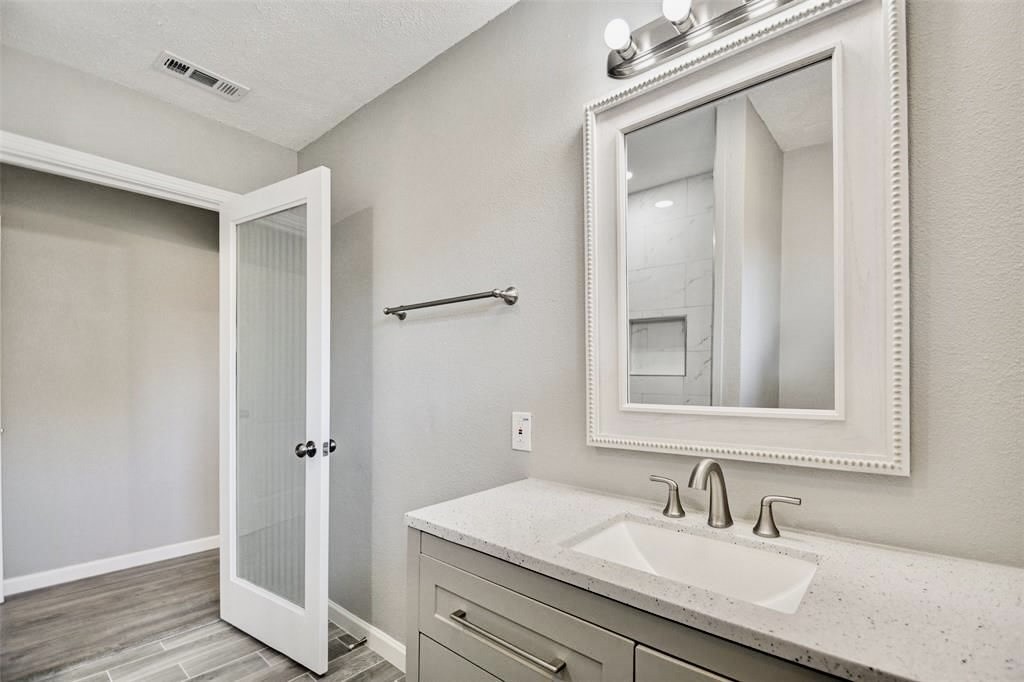 7906 Hammerly Boulevard Houston, TX 77055 - Photo 17 of 22 a bathroom with a sink double vanity and a mirror