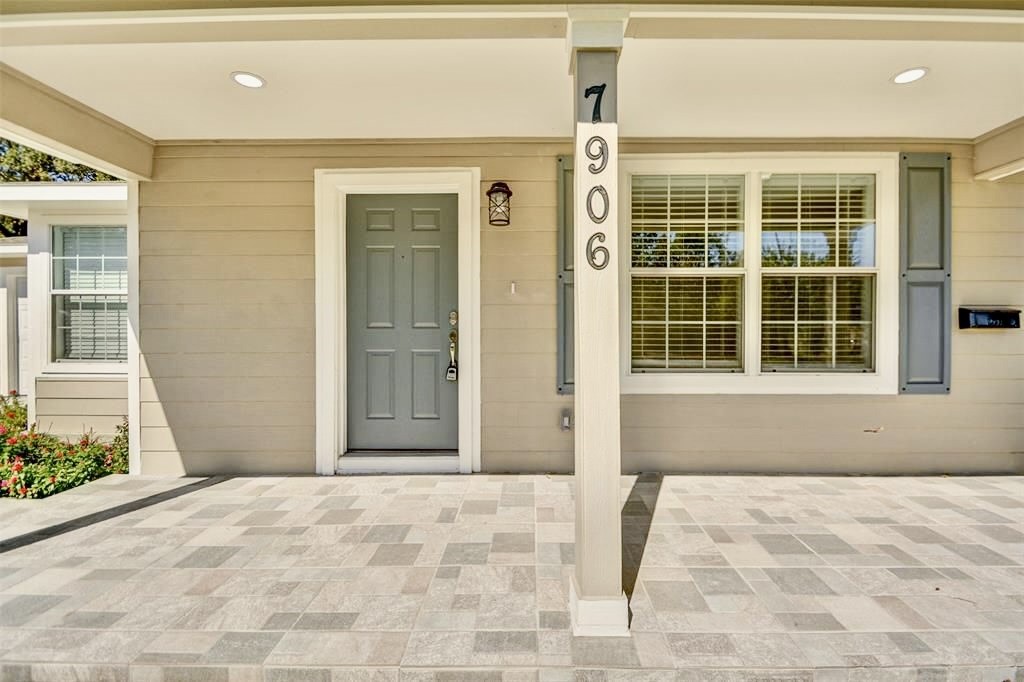 7906 Hammerly Boulevard Houston, TX 77055 - Photo 3 of 22 a front view of a house with a yard