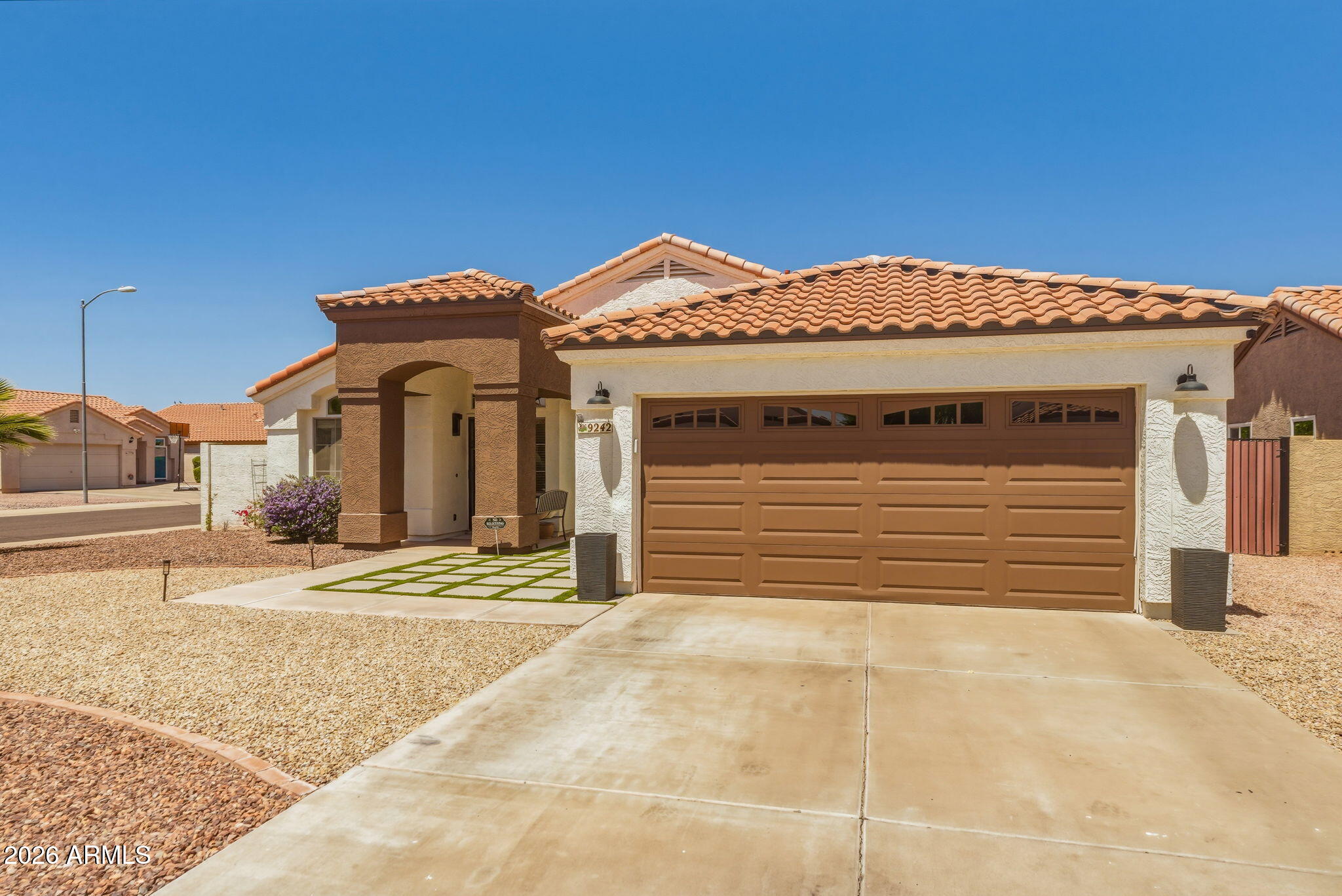 9242 West St John Road Peoria, AZ 85382 - Photo 16 of 59 a view of a house with a garage