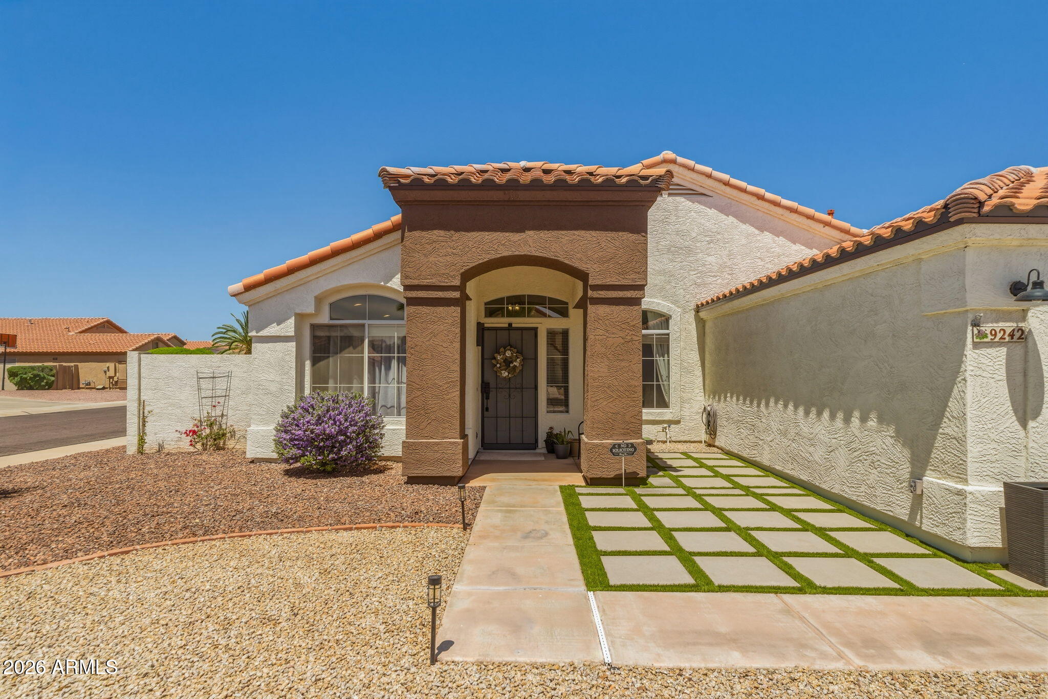 9242 West St John Road Peoria, AZ 85382 - Photo 18 of 59 a front view of a house with a yard