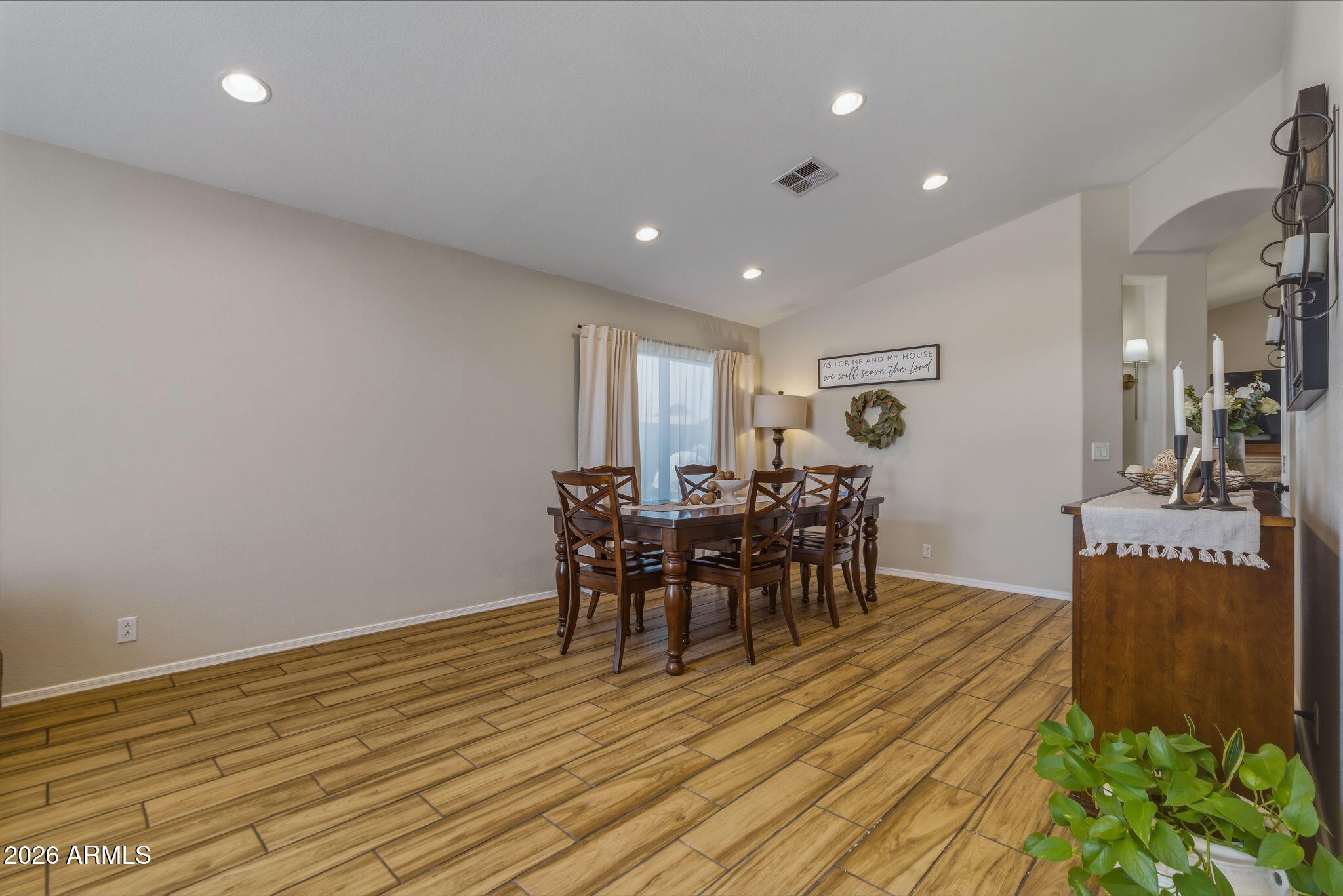 9242 West St John Road Peoria, AZ 85382 - Photo 20 of 59 a view of a dining room with furniture and wooden floor