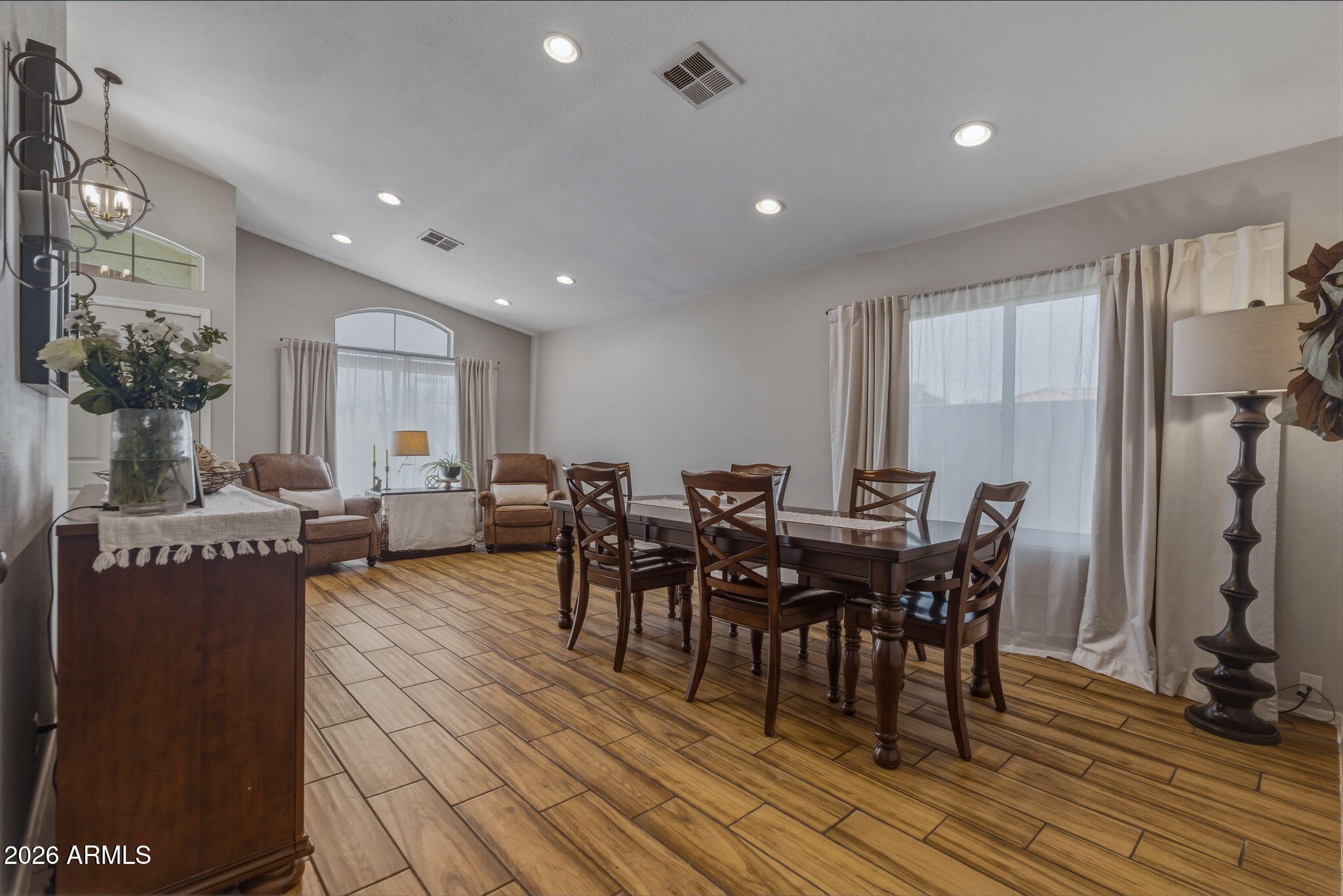 9242 West St John Road Peoria, AZ 85382 - Photo 23 of 59 a view of a dining room with furniture window and wooden floor