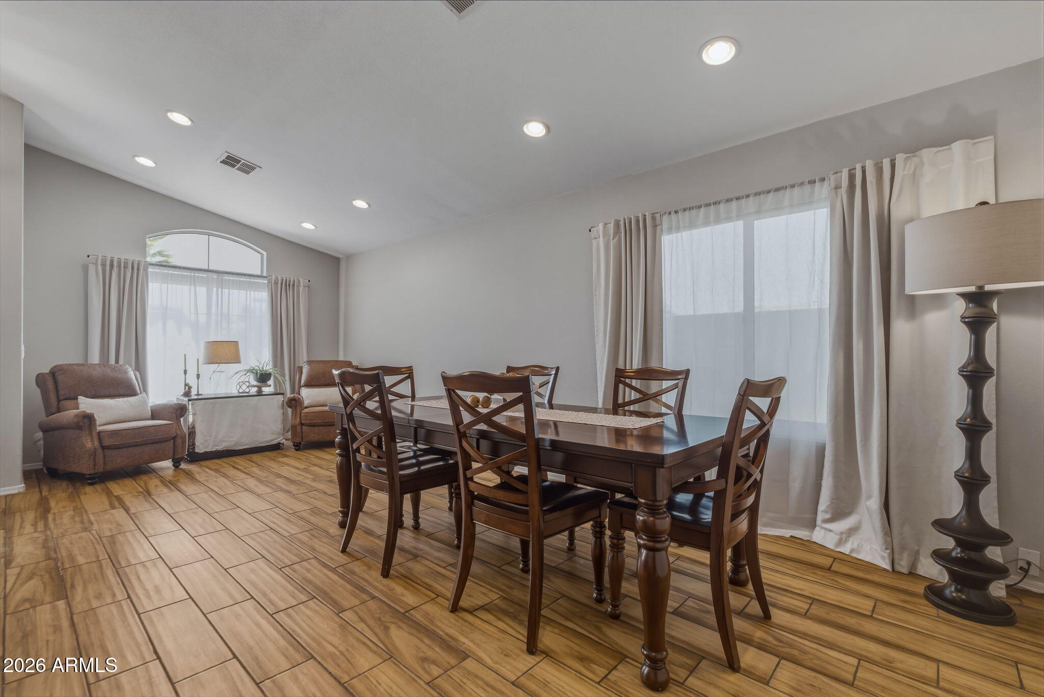 9242 West St John Road Peoria, AZ 85382 - Photo 24 of 59 a view of a dining room with furniture and a rug