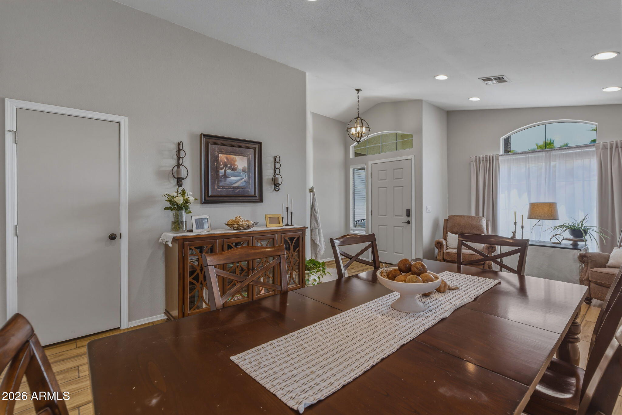 9242 West St John Road Peoria, AZ 85382 - Photo 25 of 59 a living room with furniture a window and a table