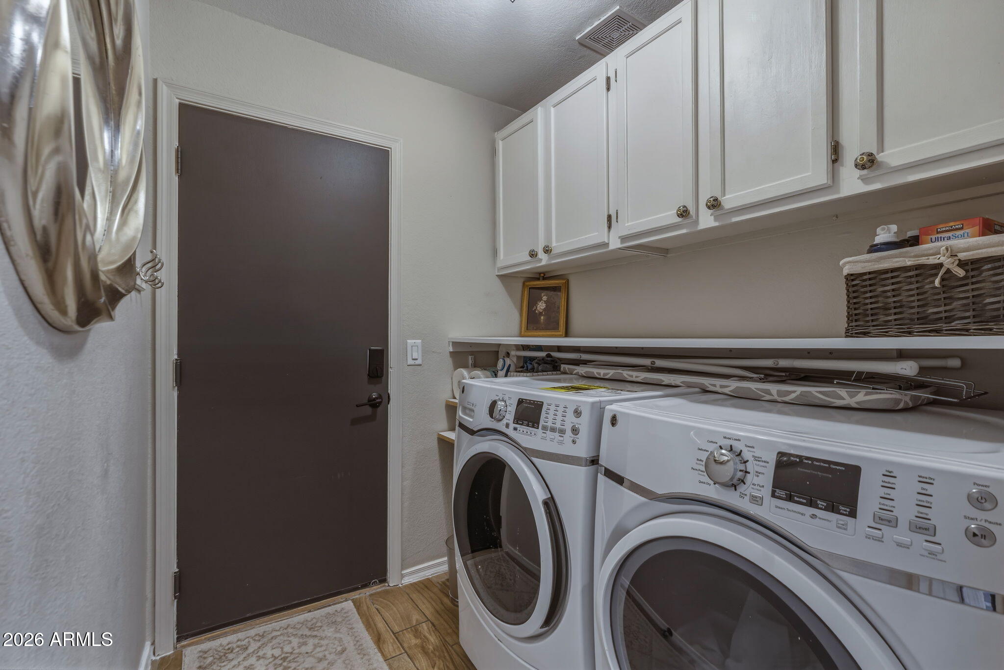 9242 West St John Road Peoria, AZ 85382 - Photo 34 of 59 a utility room with dryer and washer