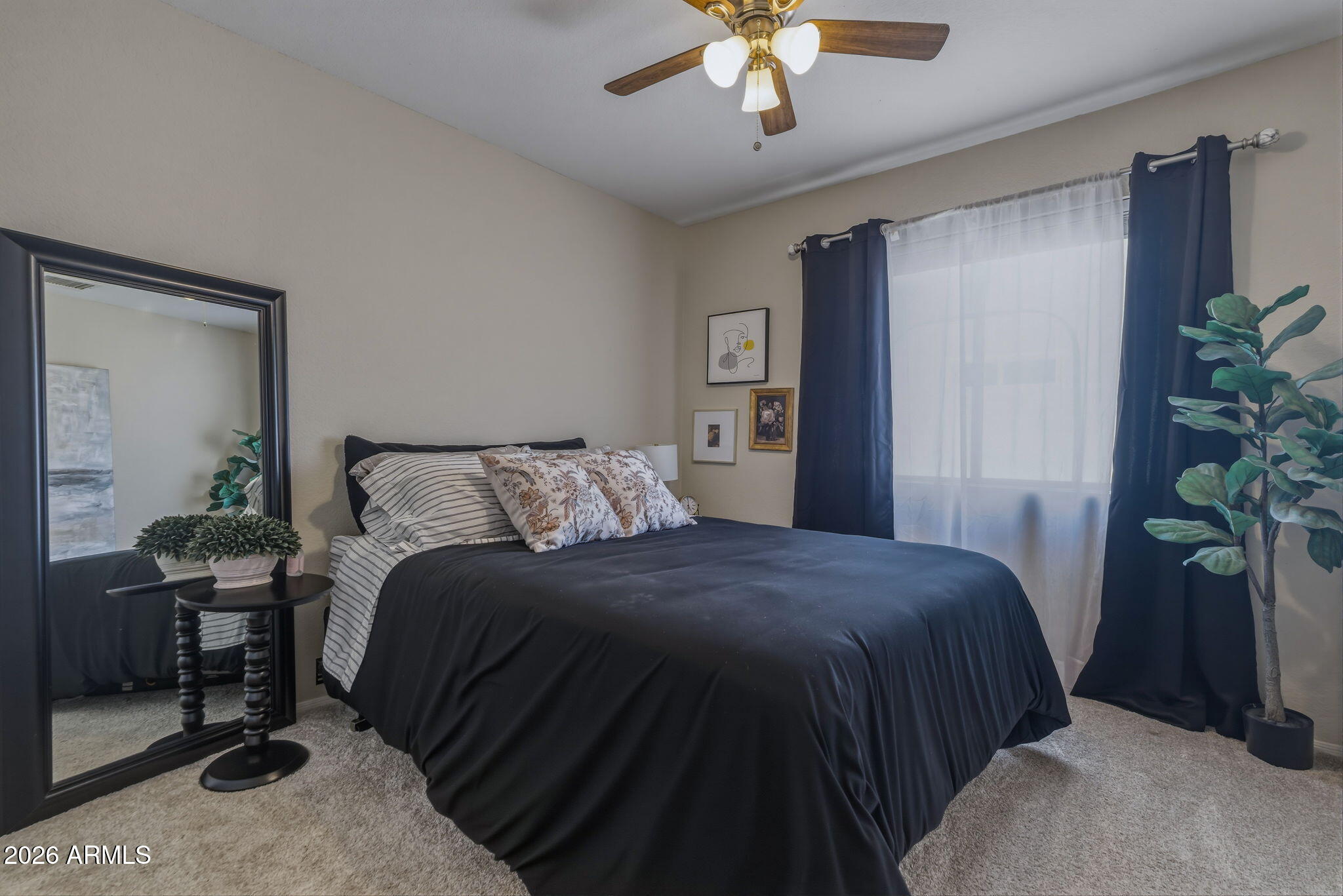 9242 West St John Road Peoria, AZ 85382 - Photo 41 of 59 a bedroom with a bed and a potted plant