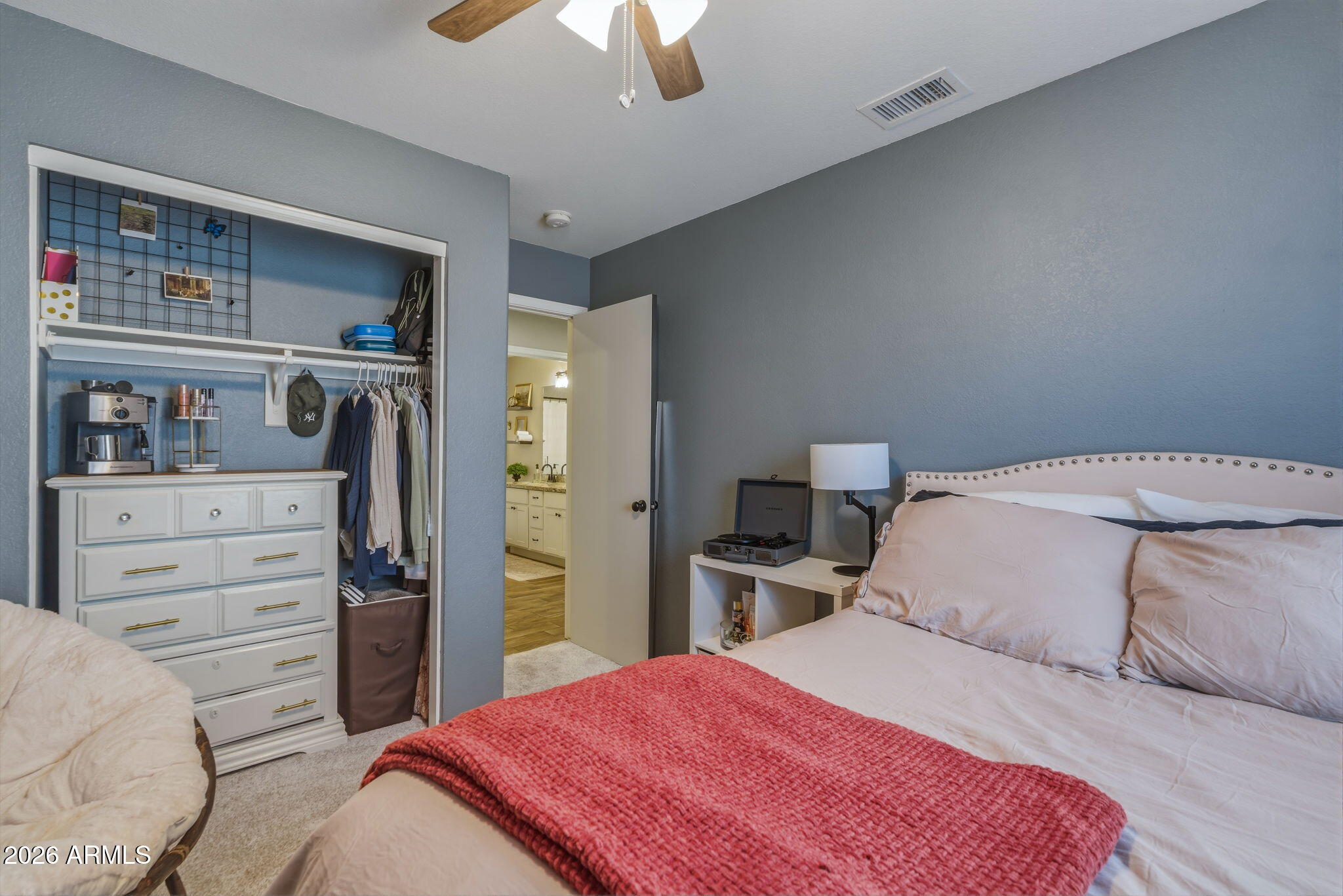 9242 West St John Road Peoria, AZ 85382 - Photo 45 of 59 a bedroom with a bed and closet