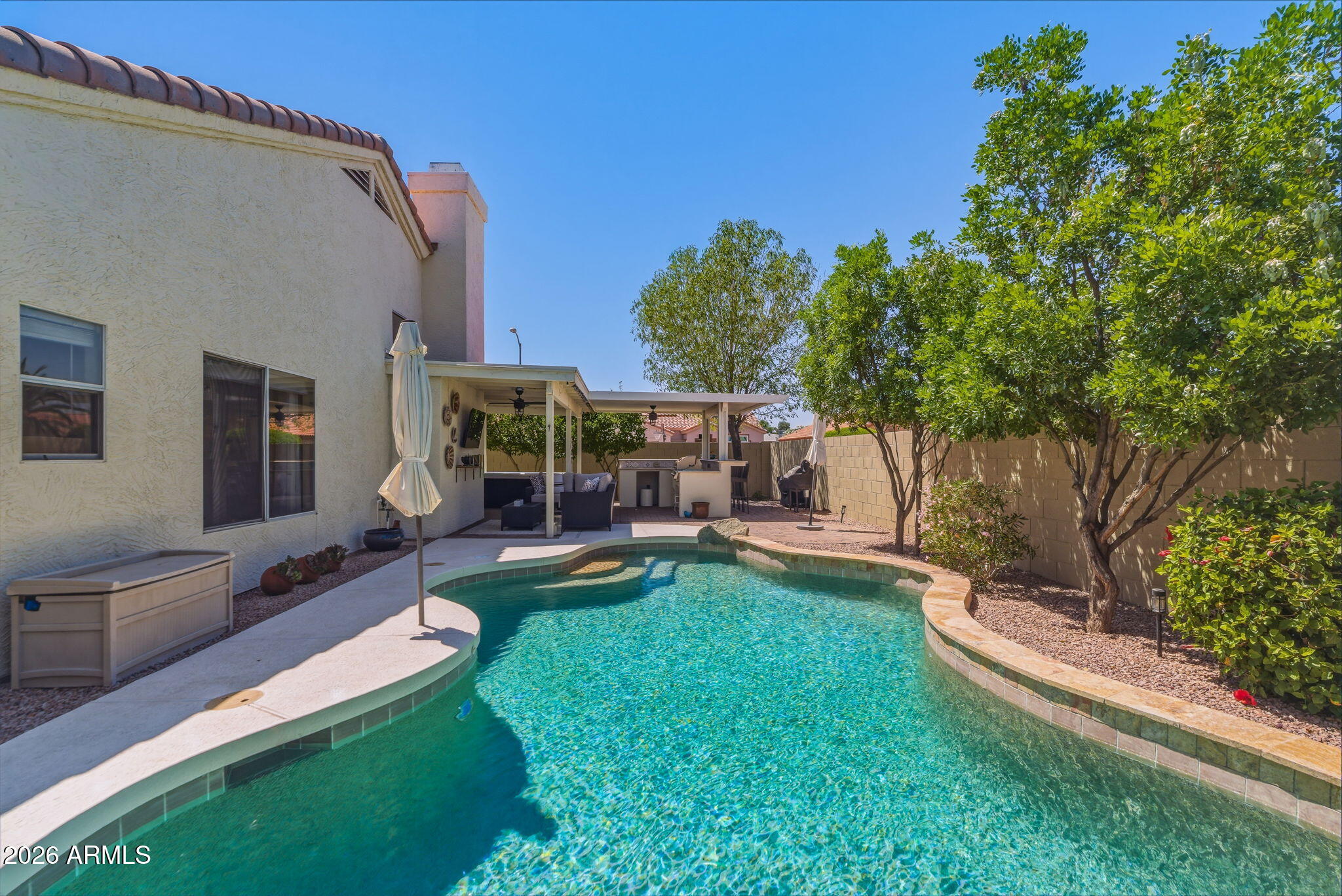 9242 West St John Road Peoria, AZ 85382 - Photo 51 of 59 a view of a house with backyard porch and sitting area