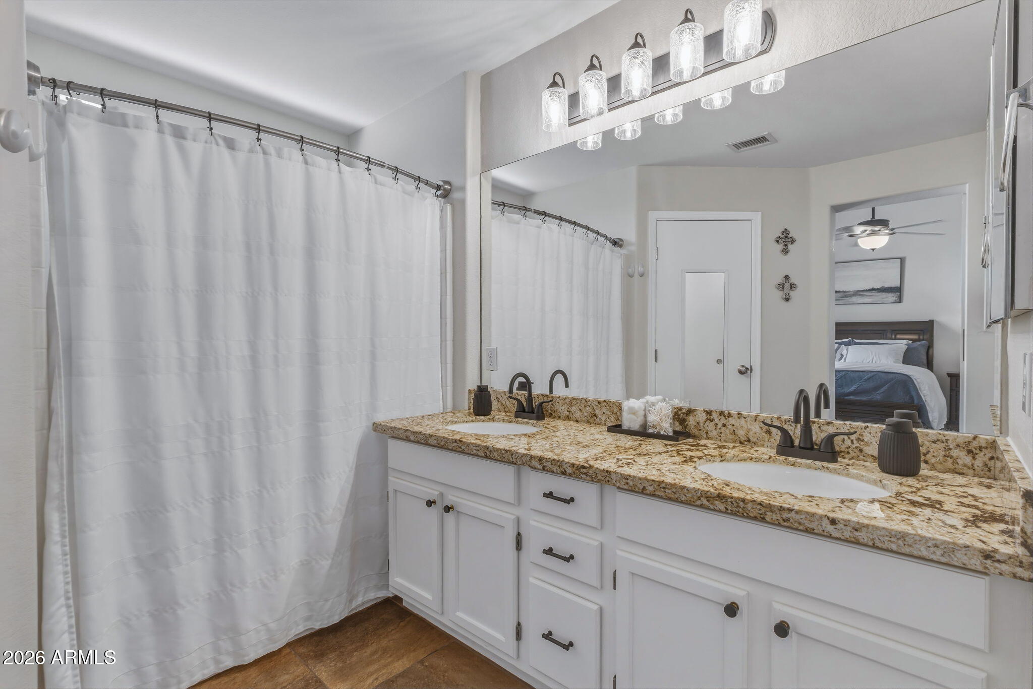 9242 West St John Road Peoria, AZ 85382 - Photo 8 of 59 a bathroom with a granite countertop sink and a mirror