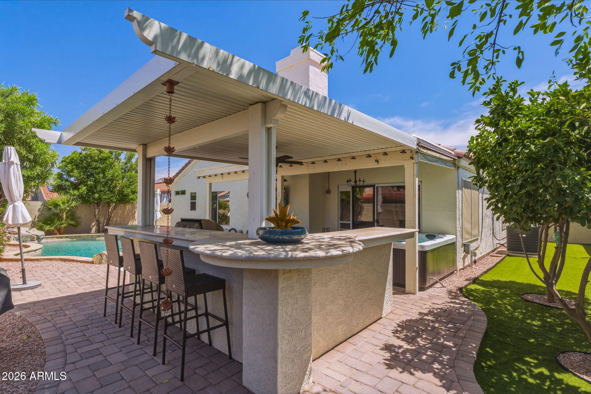 9242 West St John Road Peoria, AZ 85382 - Photo 9 of 59 a view of a patio with table and chairs potted plants