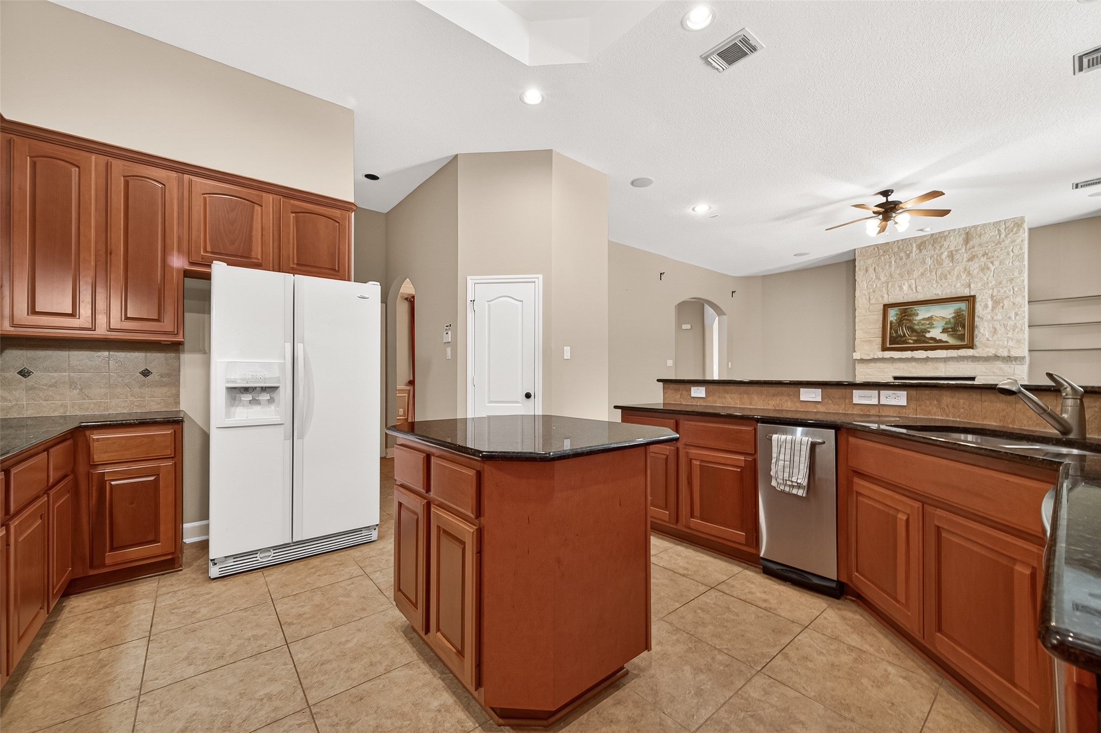 2310 Spring Lake Park Lane Spring, TX 77386 - Photo 19 of 47 a kitchen with stainless steel appliances granite countertop a refrigerator a stove and a sink
