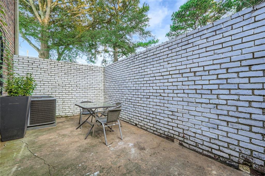 3559 Old Chamblee Tucker Road, Unit F Atlanta, GA 30340 - Photo 11 of 11 a backyard of a house with table and chairs