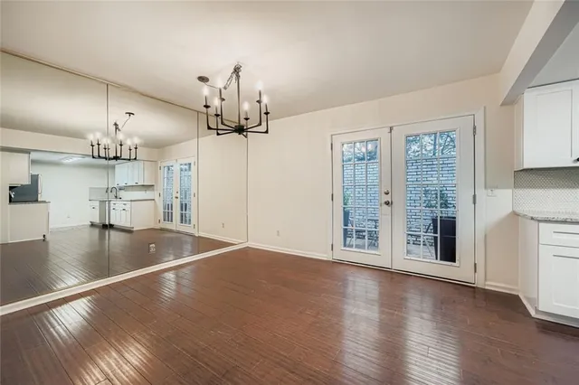 a view of a kitchen with a sink and cabinets