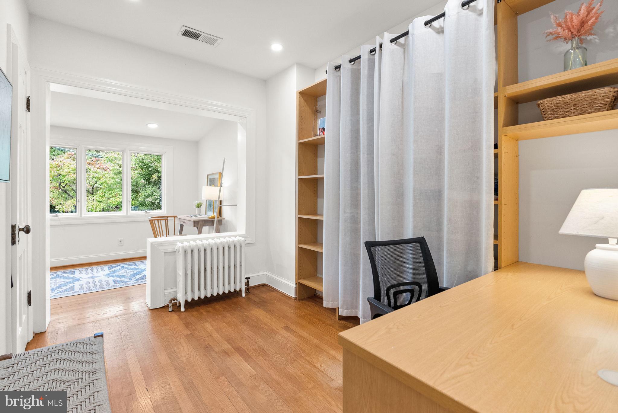 3819 T Street Northwest Washington, DC 20007 - Photo 16 of 27 a bedroom with a bed and wooden floor