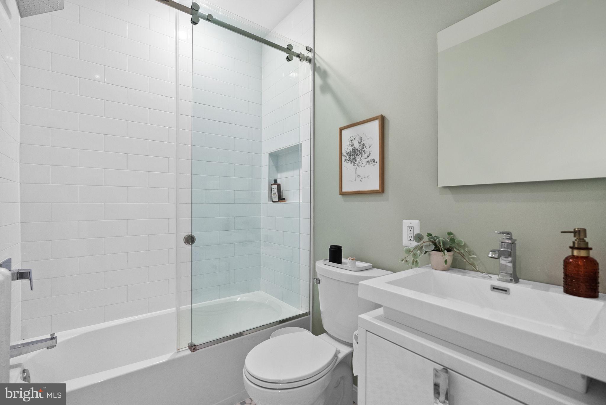 3819 T Street Northwest Washington, DC 20007 - Photo 18 of 27 a bathroom with a sink toilet and shower