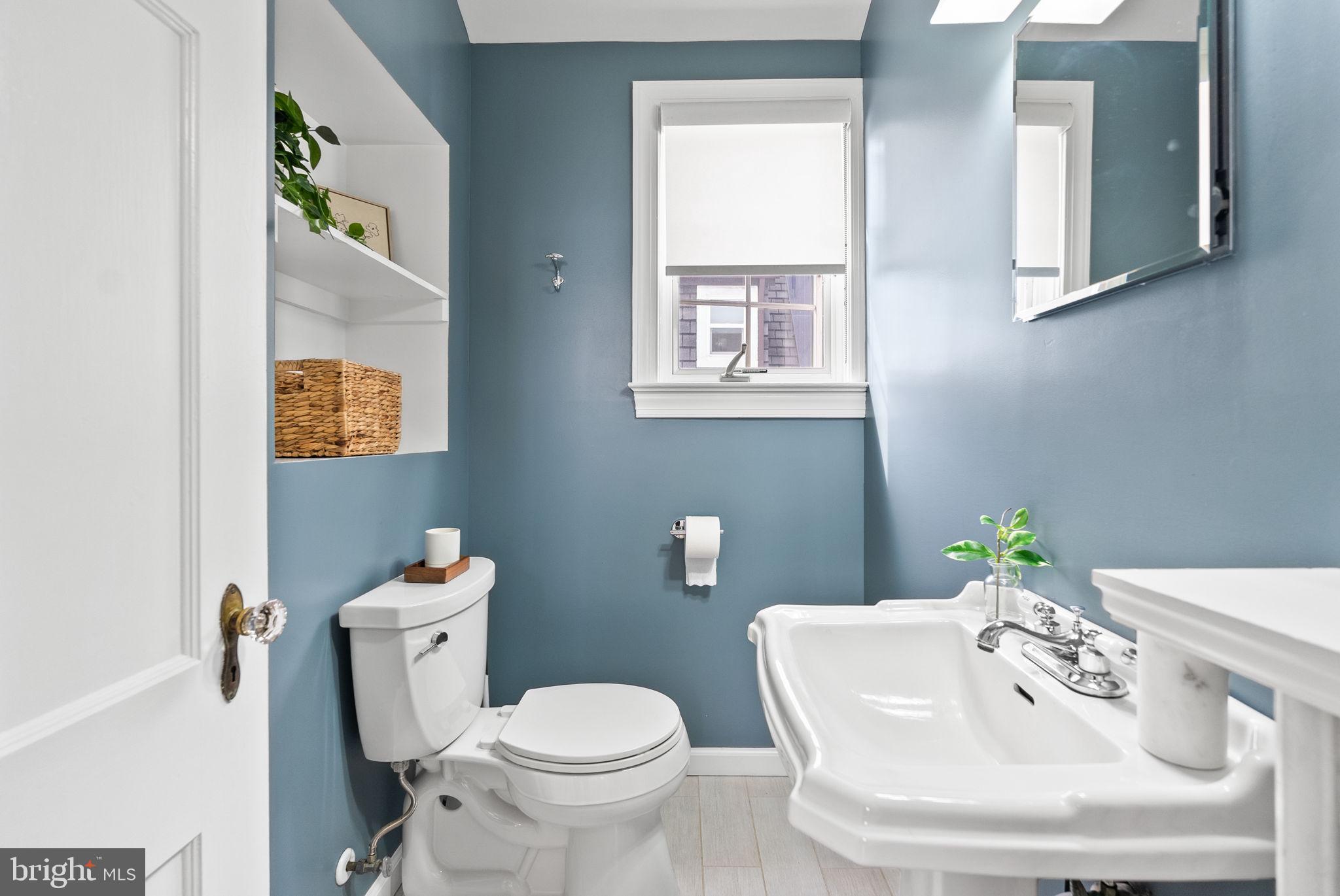 3819 T Street Northwest Washington, DC 20007 - Photo 22 of 27 a white toilet sitting next to a bathroom sink