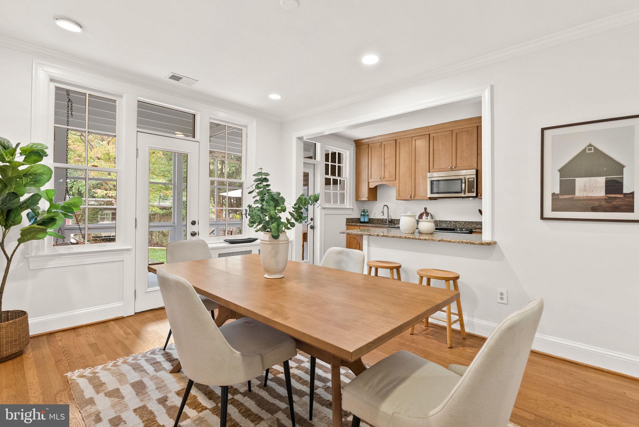 3819 T Street Northwest Washington, DC 20007 - Photo 6 of 27 a dining room with furniture and wooden floor